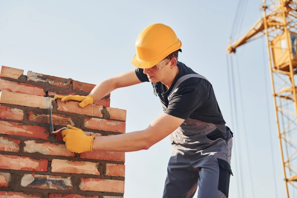 worker repairing chimney